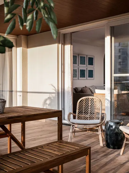 The living room extends into an open deck area, drawing you outside from the moment you step in. The design is built around nature's palette of blues and greens for relaxed, elegant living.