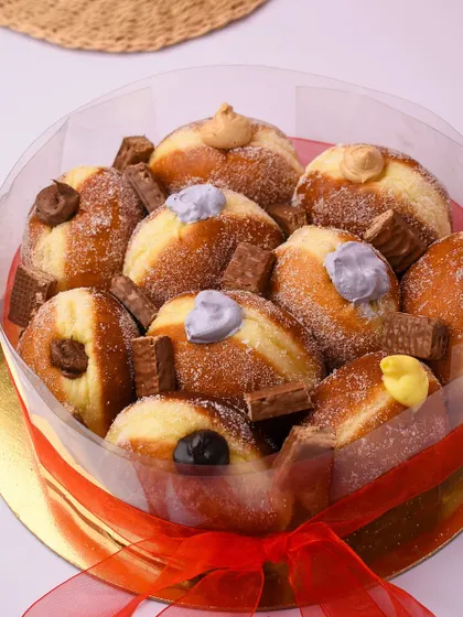 The Donut Cake! For when a single doughnut just isn't enough, we create this tower of assorted Berliners for birthdays and special occasions.