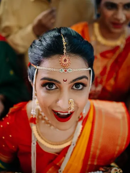 The bride's surprised and delighted expression during the ceremony. Capturing these fleeting reactions is what makes candid wedding photography so special.
