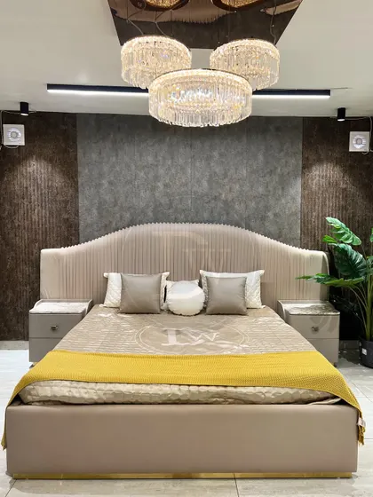 Your bedroom should be a retreat. We designed this grand, fully upholstered bed to be the centerpiece of your sanctuary. Notice the channel-tufted headboard and the elegant proportions, all crafted in our workshop to create a feeling of pure luxury.