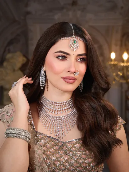 Another beautiful portrait showing the harmony between the makeup, the diamond jewelry, and the soft pastel outfit.