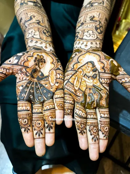 A close-up of the Radha-Krishna portraits on the palms, a testament to the detailed and personalized artwork I offer for my brides.