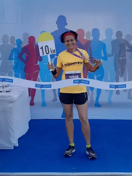 My finisher photo from the Adani Ahmedabad Marathon, where I ran a new 10K personal best of 43:53.