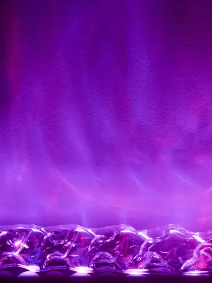 Create a dramatic mood with our Aurora Borealis-inspired wall wash light. This fixture uses a special lens to cast a vibrant, colorful light effect that mimics the northern lights, perfect for creating a unique ambiance in media rooms or lounges.