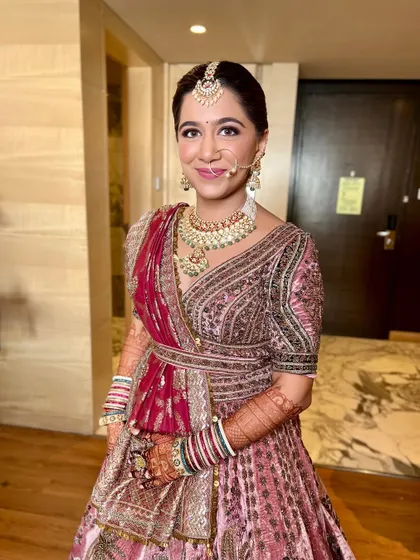 A smiling portrait of the bride, looking confident and beautiful on her special day.