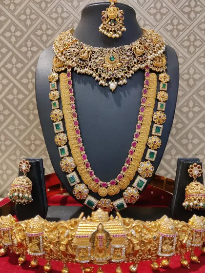 A unique bridal set combining a peacock choker with a Navratna-style coin haram.