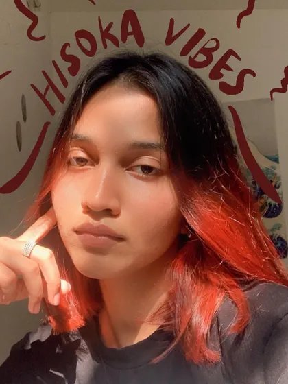 Hisoka vibes with this red and black hair. The doodles match the anime-inspired look.