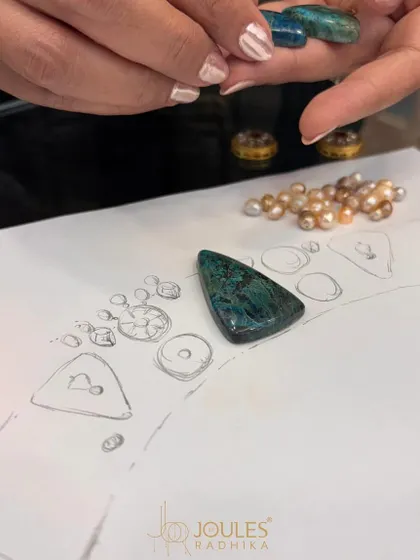 The first glimpse of a new collection. Here, I am selecting stones and pearls, matching them to the initial sketches for a new design.