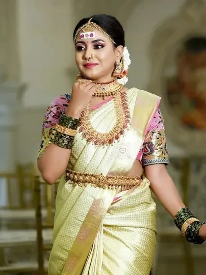 A classic bridal portrait. The choker and haram combination is a timeless choice for South Indian weddings.