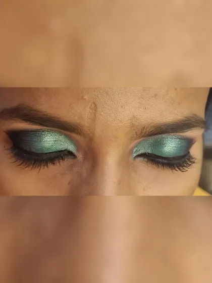 Another angle of the green half-smokey eye, showing the blending and the sharp winged liner.