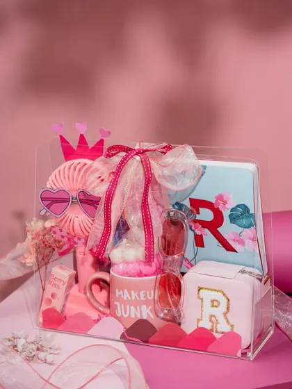 Gifting for little ones is all about sparking imagination. This 'Pretty in Pink' hamper is filled with personalized goodies, from a monogrammed pouch and mug to fun accessories, creating a truly special treat for a little princess.
