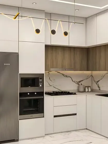 A stunning example of modern kitchen design, this space combines white and wood-grain cabinets with a beautiful marble backsplash. The integrated appliances and unique light fixture add a touch of luxury and personality.