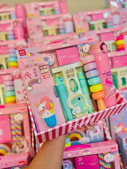 A complete Unicorn-themed stationery set, featuring a pencil case, pen, highlighters, and a water bottle, all beautifully arranged in a custom box.