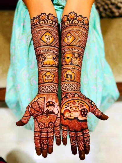 I love creating special designs for moms-to-be. This Godh Bharai or baby shower mehndi is filled with cute, celebratory details like a baby carriage, tiny clothes, and "Mom to be" messages to make the day unforgettable.