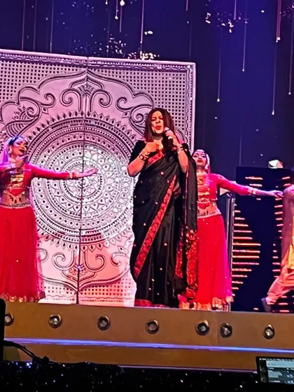 A wide shot of my performance, showing the synergy between my singing and the graceful dancers on stage. Together, we tell a story through music and movement.