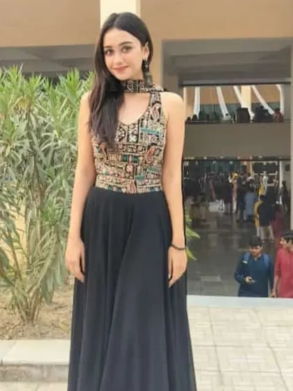 A chic and modern black gown with a beautifully embroidered sleeveless top. This is a great rental option for a formal event or a friend's reception.