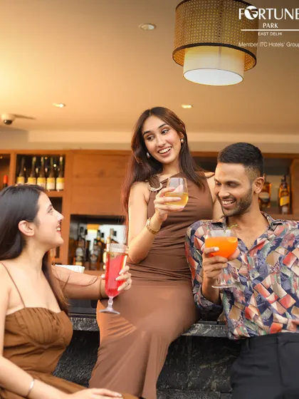 Laughter and good times are always on the menu at Neptune. Here, friends gather at the bar to share drinks and make memories.