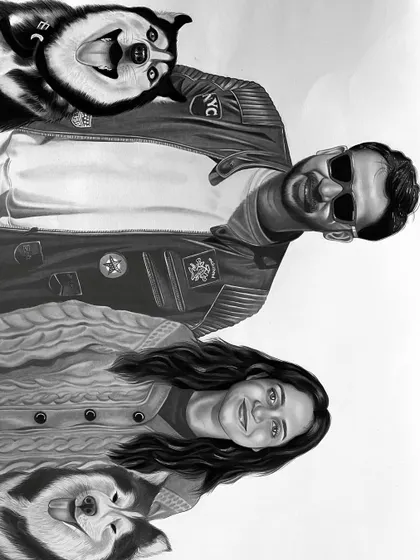 The final charcoal sketch of the couple and their two dogs, created by combining five photos. This piece took over 15 hours to complete, ensuring every detail was just right.
