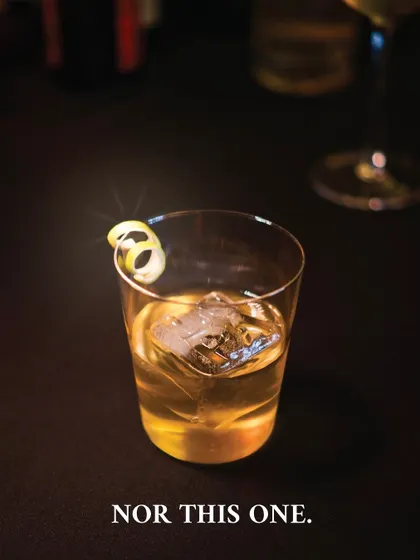 A photo of a clear, elegant cocktail with the text "Nor this one." This was part of a teaser campaign for Negroni Week, playfully challenging perceptions of what a Negroni looks like.