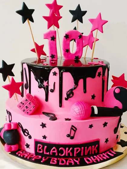 Another take on the Blackpink theme, this cake features a black chocolate drip and edible microphone for a 10th birthday.