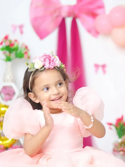 Turning three in style! Milestone birthdays are such a joy to photograph. I love creating vibrant, fun setups with balloons and props that perfectly match your little one's personality.