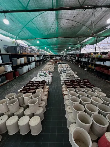 An aisle view of our planter section. We stock thousands of pots to ensure you find the perfect match for your plants and your home decor.