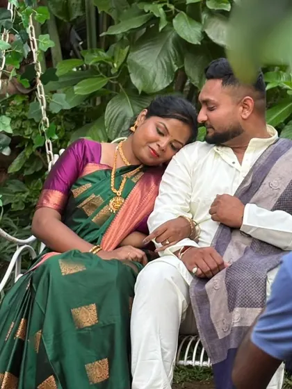 A quiet, tender moment captured during the shoot. Her traditional look is complete with flawless makeup and hair, making her look absolutely serene.