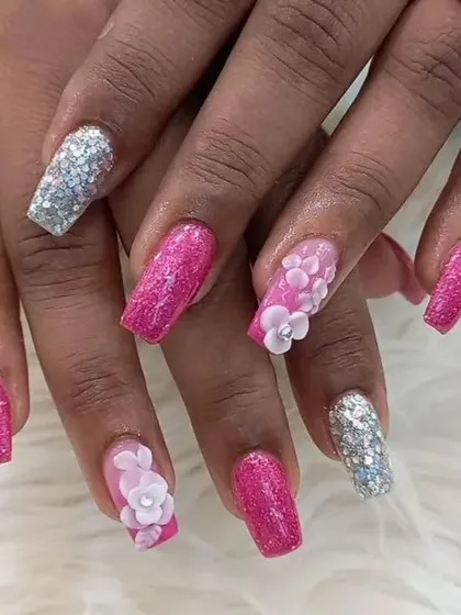 Another angle of the vibrant pink and silver 3D manicure, showing how the different elements come together for a cohesive and glamorous design.
