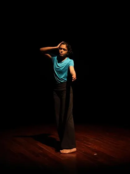 A dancer strikes a pose during a tech run.