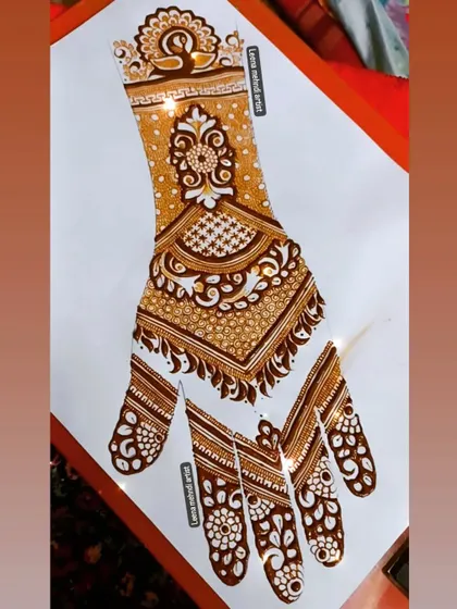 The completed bridal practice design, ready to be replicated on a bride's hands. This design features a prominent peacock cuff, a floral mandala, and detailed finger work.