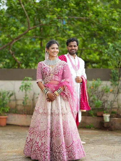 Your portfolio can also include couple shots to show how your makeup work fits into a complete wedding scene. Here is the same pink lehenga styled for a pre-wedding or wedding day shoot.