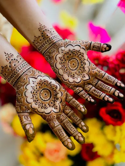 An angled view of the symmetrical floral mandala design against a colorful background.