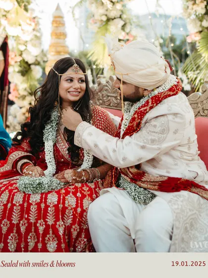 A sweet moment captured during the wedding ceremony. The groom gently touches his bride's chin, a small gesture full of love and affection.