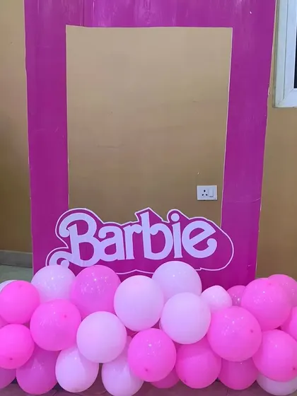 I can create fun photo opportunities like this life-sized Barbie box photo booth. It's a perfect, interactive addition to any Barbie-themed birthday party.