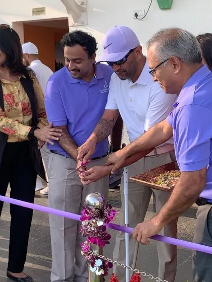 Another shot of the ribbon-cutting ceremony for the Purple Academy. The smiles and shared excitement in this photo capture the collaborative spirit behind making golf possible for more people in our community.