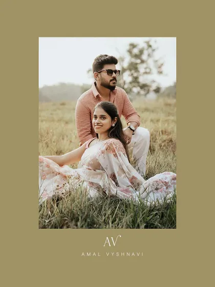 A relaxed portrait of a couple sitting in a field, personalized with their initials.