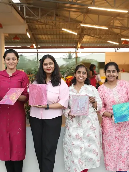 Participants from Setty Mech Engineers showing their beautiful fluid art creations. Each piece is as unique as the person who made it.