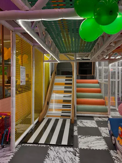 A look at our multi-level play structure, featuring slides and stairs for endless exploration and adventure.