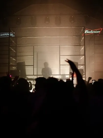 A four hour set in Bombay just flew by. This atmospheric shot captures the unique stage setup at Anti Social, with the crowd silhouetted against the haze and lights.