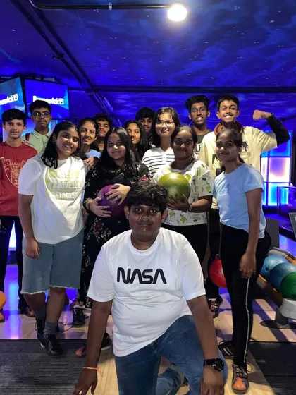 A large group of kids enjoying a day out at our bowling alley.