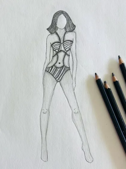 Another example of pencil rendering, this time a one-piece swimsuit with strap details. These exercises improve the quality and realism of line drawings.