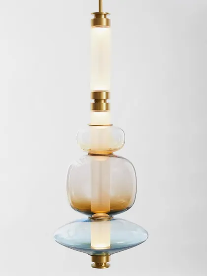 A studio shot of a Luna pendant, highlighting its perfectly balanced composition of colored glass and illuminated tubes.