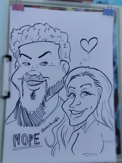 A playful "Nope" shirt adds a bit of humor to this couple's caricature. I love incorporating personal details like this.