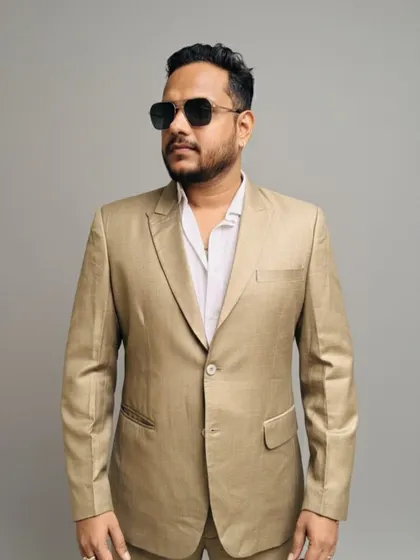 A simple and elegant beige blazer that is perfect for daytime events. The light color and clean design make it a great rental for a summer wedding or outdoor party.