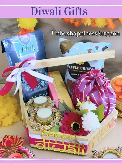 A different perspective of the wooden tray hamper, showing the 'Happy Diwali' inscription and the handcrafted diya holders.