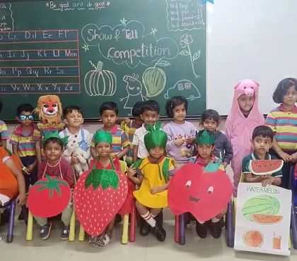 Students dressed as fruits and vegetables for a themed 'Show and Tell' competition, making learning about healthy eating fun and interactive.