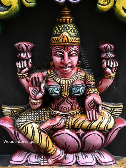 Detail of Dhana Lakshmi from our 72-inch vertical Astalakshmi panel, hand-painted in rich pinks and yellows.