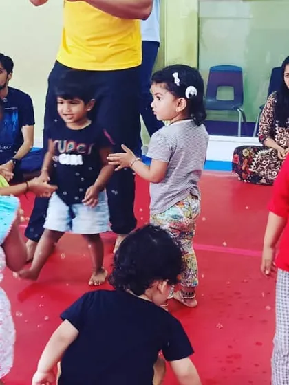 A collection of joyful moments from a Saturday evening "Super Beasts" class, featuring bubble time, group activities, and lots of smiles between parents and children.