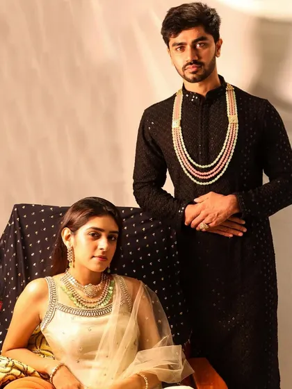 Another shot of this stunning couple. She is wearing a detachable Polki necklace with emeralds, and he is wearing a Polki necklace with emerald and rose quartz. Proof that couples who sparkle together, stay together.