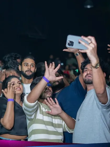 Festival attendees taking a selfie with the party in the background. I love it when my music becomes the soundtrack to people's unforgettable memories.